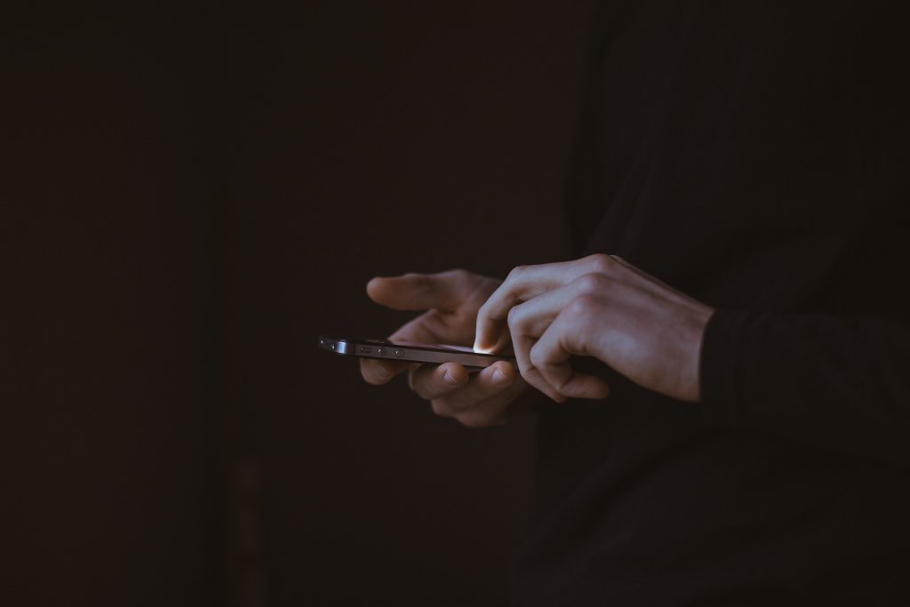 Person using mobile phone with eSIM